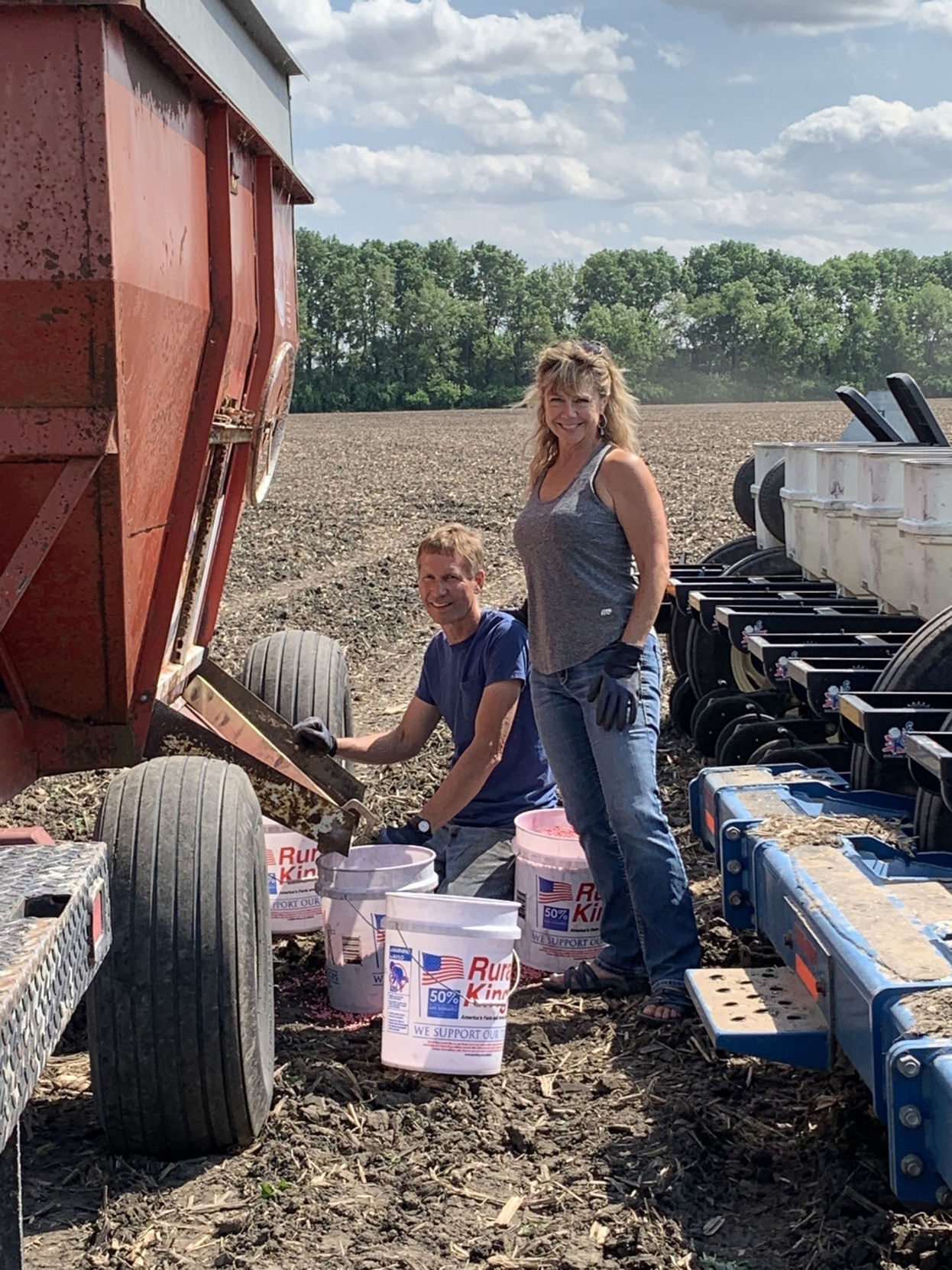 Scott and Sarah Ziegler loading planter.jpg